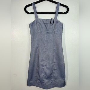 Just Bad Temper denim mini dress, size XS, with wide straps and buckle.
